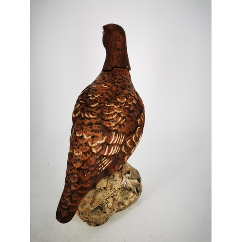 270 - A FAMOUS GROUSE WHISKY DECANTER, in the form of the well-known grouse. In fair/good condition.