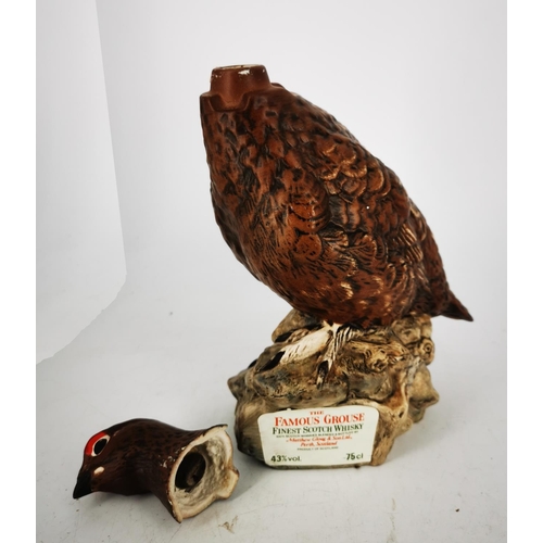 270 - A FAMOUS GROUSE WHISKY DECANTER, in the form of the well-known grouse. In fair/good condition.