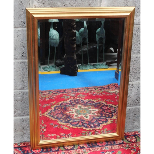 287 - A RECTANGULAR GILT WALL MIRROR, 	a simple and sizeable mirror with a multi-level bevel on the gilt f... 