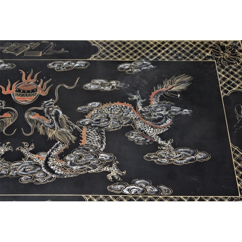 288 - A TWENTIETH CENTURY CHINOISERIE PAINTED COFFEE TABLE,	with a lacquered surface richly decorated with... 