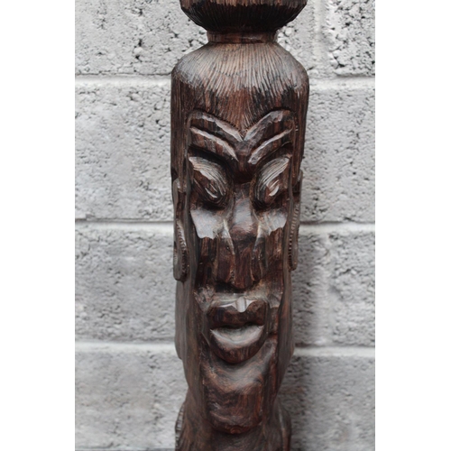 292 - A FIGURATIVE WOODEN SCULPTURAL CARVING, possibly African in origin. Showing a full head with carved ... 