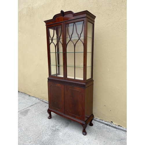 3 - A GOOD QUALITY MAHOGANY CHIPPENDALE STYLE GLZED DISPLAY CABINET, the top with raised centre having a... 