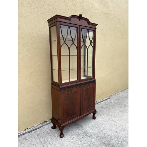 3 - A GOOD QUALITY MAHOGANY CHIPPENDALE STYLE GLZED DISPLAY CABINET, the top with raised centre having a... 