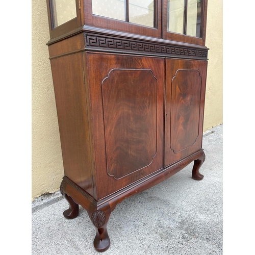 3 - A GOOD QUALITY MAHOGANY CHIPPENDALE STYLE GLZED DISPLAY CABINET, the top with raised centre having a... 