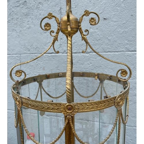 53 - A LARGE REGENCY HALL LANTERN, with scrolling floral & foliage decoration linking the circular lanter... 