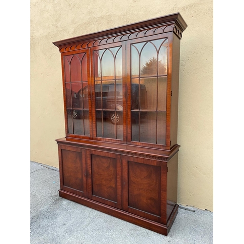 54 - A GOOD MAHOGANY LIBRARY/GLAZED BOOKCASE, with stepped tapered pediment over a band of gadrooned deta... 