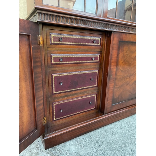 54 - A GOOD MAHOGANY LIBRARY/GLAZED BOOKCASE, with stepped tapered pediment over a band of gadrooned deta... 