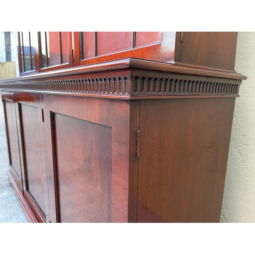 54 - A GOOD MAHOGANY LIBRARY/GLAZED BOOKCASE, with stepped tapered pediment over a band of gadrooned deta... 