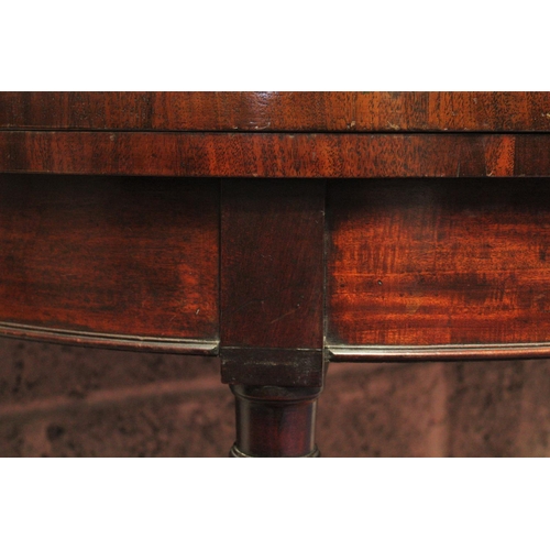 66 - A FINE GEORGIAN DEMI LUNE FOLD OVER MAHOGANY CARD TABLE,	with subtle cross-banding to be found on th... 