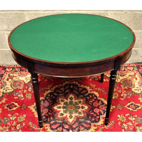 66 - A FINE GEORGIAN DEMI LUNE FOLD OVER MAHOGANY CARD TABLE,	with subtle cross-banding to be found on th... 