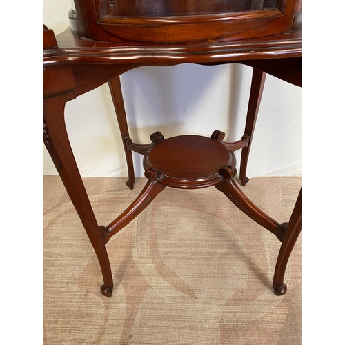 68 - AN UNUSUAL CIRCULAR MAHOGANY DISPLAY CABINET, bow fronted glass to front, with two turned supports, ... 