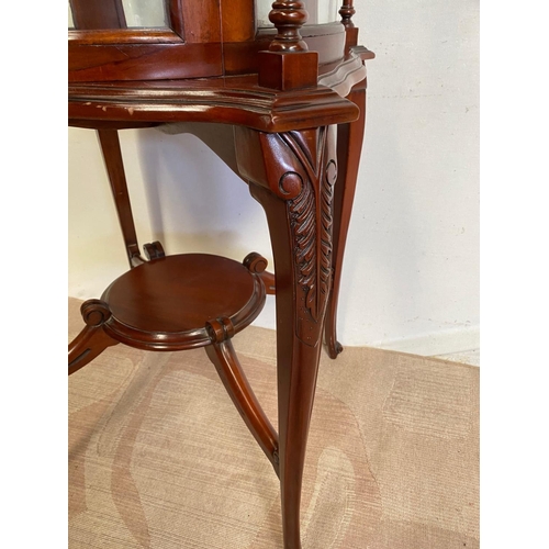 68 - AN UNUSUAL CIRCULAR MAHOGANY DISPLAY CABINET, bow fronted glass to front, with two turned supports, ... 