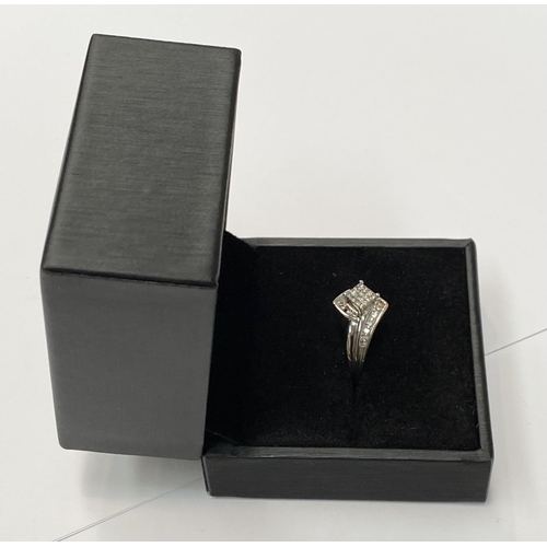 69 - A BEAUTIFUL WHITE GOLD DIAMOND CROSS-OVER RING, a really dynamic piece of handmade jewellery; with a... 