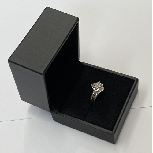 69 - A BEAUTIFUL WHITE GOLD DIAMOND CROSS-OVER RING, a really dynamic piece of handmade jewellery; with a... 