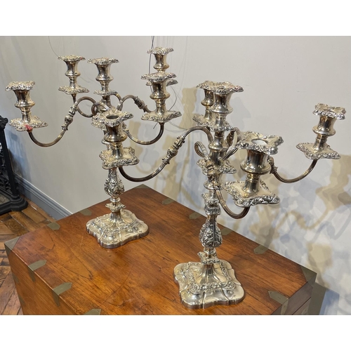 70 - A FINE PAIR OF LATE 19TH CENTURY SILVER PLATED CANDELABRA, in the Rococo style, with a set of four r... 