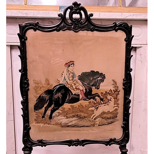 73 - A 19TH CENTURY CARVED PICTURE PANEL FIRE SCREEN, the ornate frame decorated all over with scrolling ... 