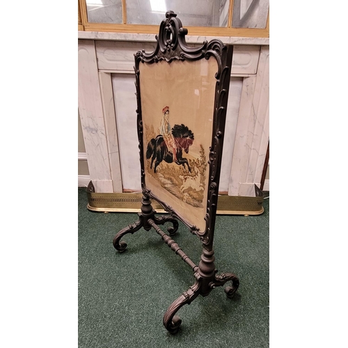 73 - A 19TH CENTURY CARVED PICTURE PANEL FIRE SCREEN, the ornate frame decorated all over with scrolling ... 