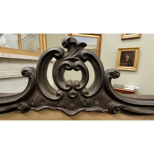 73 - A 19TH CENTURY CARVED PICTURE PANEL FIRE SCREEN, the ornate frame decorated all over with scrolling ... 