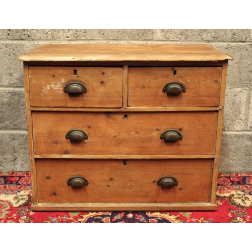 78 - A RUSTIC PINE COUNTRY CHEST OF DRAWERS	aged and worn but with delightful character; the wood knottin... 