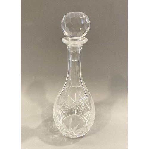 99 - AN IRISH CUT GLASS DECANTER, finely cut with diamond pattern with associated circular stopper, 32cm ... 