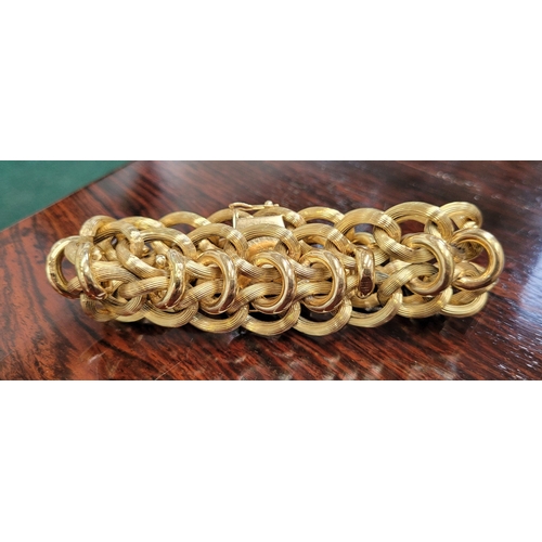 119 - A VINTAGE 18CT YELLOW GOLD LINK BRACELET, circa 1950. A charming vintage piece; designed with a seri... 