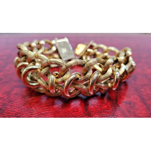 119 - A VINTAGE 18CT YELLOW GOLD LINK BRACELET, circa 1950. A charming vintage piece; designed with a seri... 