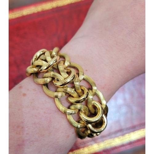 119 - A VINTAGE 18CT YELLOW GOLD LINK BRACELET, circa 1950. A charming vintage piece; designed with a seri... 