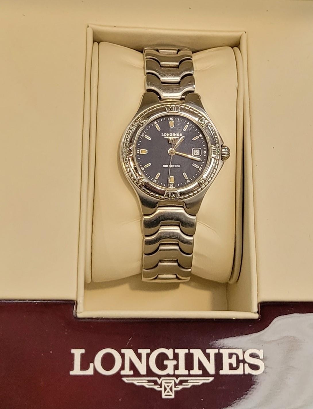 A LADIES LONGINES CASED SPORT WING WATCH Swiss made stainless