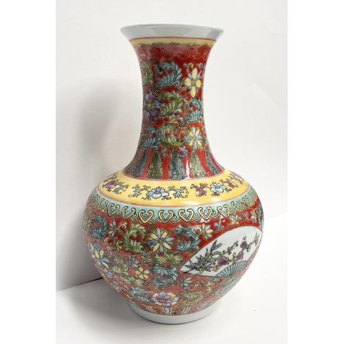 10 - A CHINESE FAMILLE-ROSE BOTTLE VASE, Qianlong period, the compressed globular body rising to a waiste... 