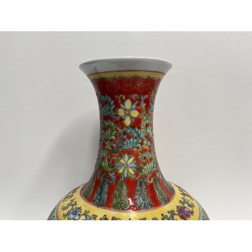 10 - A CHINESE FAMILLE-ROSE BOTTLE VASE, Qianlong period, the compressed globular body rising to a waiste... 