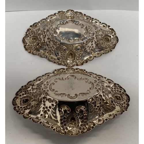 105 - A SILVER PLATED LOT TO INCLUDE (i) Two decorative silver plated bonbon dishes, both with twist desig... 