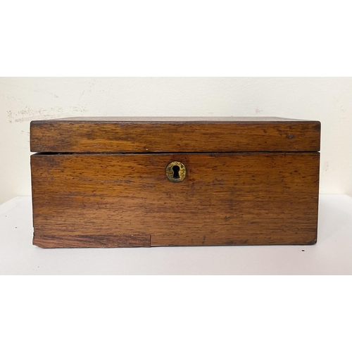 109 - A VICTORIAN MAHOGANY TEA CADDY, opening to two compartments, labelled, with measuring spoon, Dimensi... 