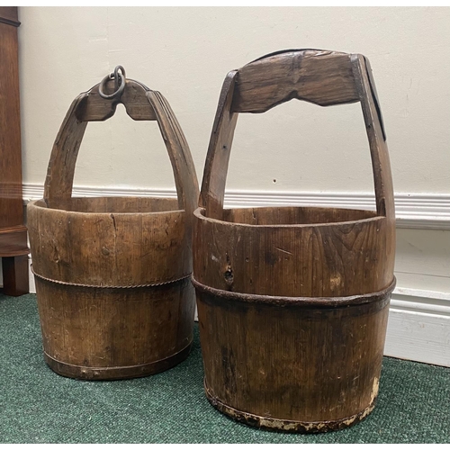 111 - TWO ANTIQUE ROUND COOPERED WOODEN WATER BUCKETS, one with iron binding, both with carrying handles, ... 