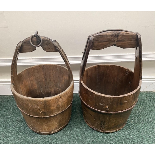 111 - TWO ANTIQUE ROUND COOPERED WOODEN WATER BUCKETS, one with iron binding, both with carrying handles, ... 