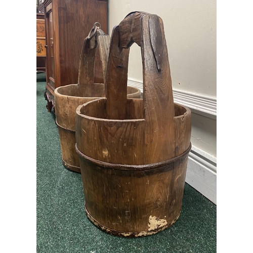 111 - TWO ANTIQUE ROUND COOPERED WOODEN WATER BUCKETS, one with iron binding, both with carrying handles, ... 