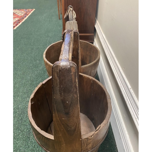 111 - TWO ANTIQUE ROUND COOPERED WOODEN WATER BUCKETS, one with iron binding, both with carrying handles, ... 