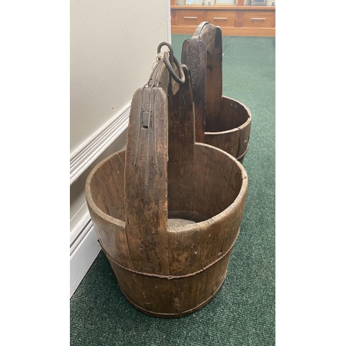 111 - TWO ANTIQUE ROUND COOPERED WOODEN WATER BUCKETS, one with iron binding, both with carrying handles, ... 