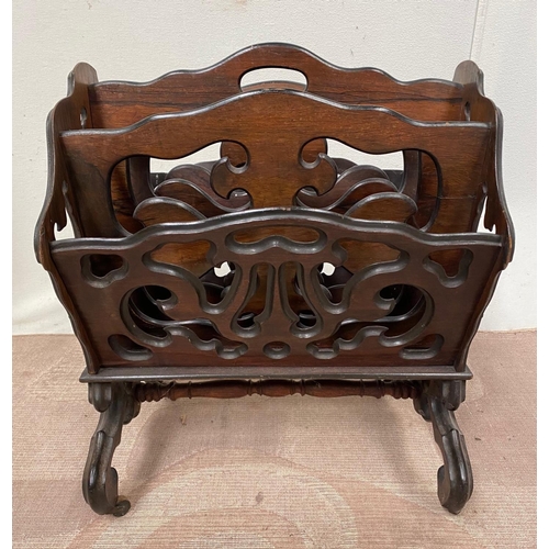 114 - A REGENCY STYLE ROSEWOOD CANTERBURY, with carved decoration and turned dividers, turned stretcher be... 