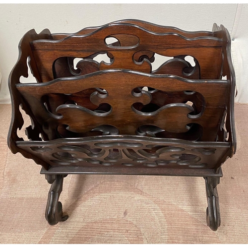 114 - A REGENCY STYLE ROSEWOOD CANTERBURY, with carved decoration and turned dividers, turned stretcher be... 