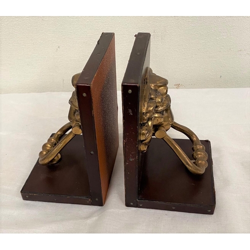 116 - A PAIR OF UNIQUE LEATHER BOUND BOOK STANDS, brown leather mounted with solid brass lion head door kn... 