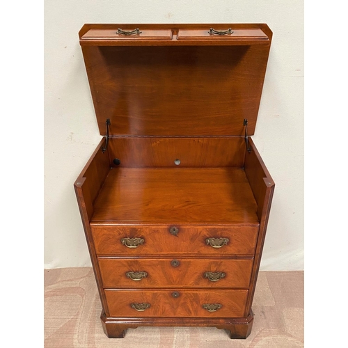 12 - A WALNUT CHEST/DRINKS CABINET, with crossbanding, lift-top revealing interior storage, three drawers... 