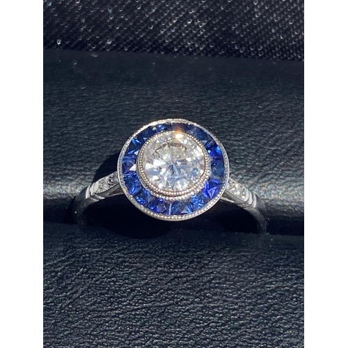 123 - AN EXCEPTIONAL 18CT WHITE GOLD ART DECO DIAMOND AND SAPPHIRE TARGET RING, centre diamond weight: .70... 