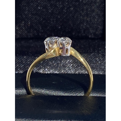 124 - A HAND-MADE 18CT YELLOW GOLD TWO STONE DIAMOND TWIST RING, Diamond weight .60cts, diamond colour G, ... 