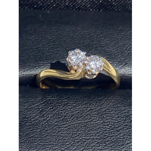 124 - A HAND-MADE 18CT YELLOW GOLD TWO STONE DIAMOND TWIST RING, Diamond weight .60cts, diamond colour G, ... 