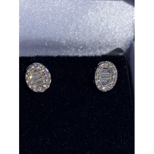 129 - A PAIR OF BEAUTIFUL WHITE GOLD DIAMOND CLUSTER STUD EARRINGS, set with baguette and brilliant cut di... 