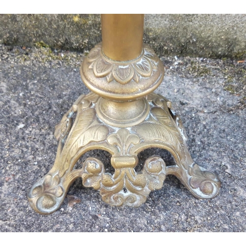 131 - A 19TH CENTURY LARGE BRASS GOTHIC CANDLESTICK HOLDER, beautifully decorated cast brass, standing on ... 