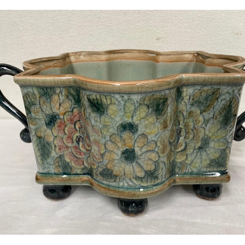 132 - A SHAPED TWO-HANDLED SERVING BOWL, finely decorated with painted glazed floral design surrounding, w... 