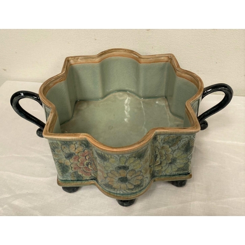 132 - A SHAPED TWO-HANDLED SERVING BOWL, finely decorated with painted glazed floral design surrounding, w... 