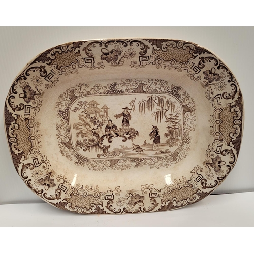 133 - A PAIR OF LARGE STONEWARE PLATTERS; each with brown & white decoration; showing figures and birds in... 