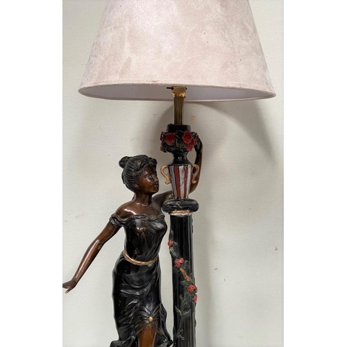 134 - A BRONZE LAMP WITH DECORATIVE BASE, featuring painted female figure and pillar with flowers, on circ... 